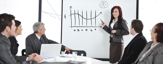 Businesswoman drawing a diagram during the presentation at office