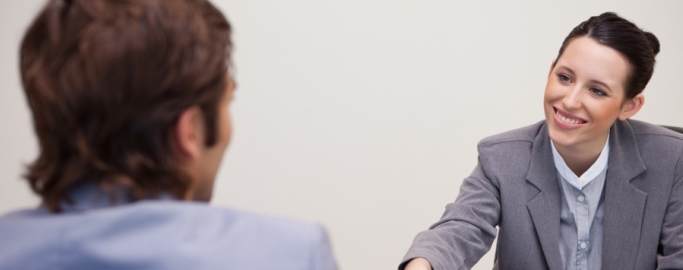 Businesswoman welcomes customer in her office