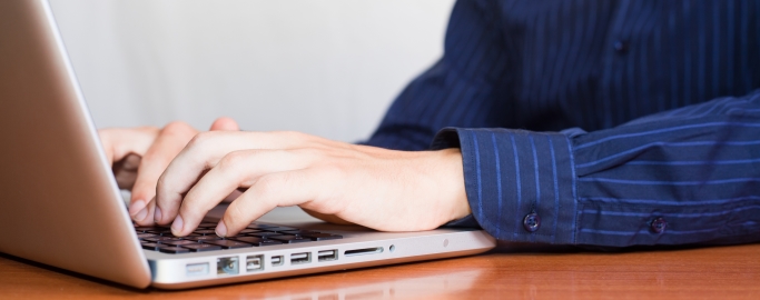 Businessman Typing on Computer Keyboard