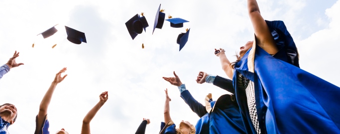 Group of happy young graduates