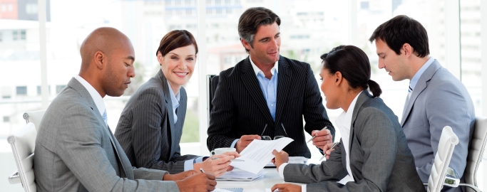 Multi-ethnic business people disscussing a budget plan