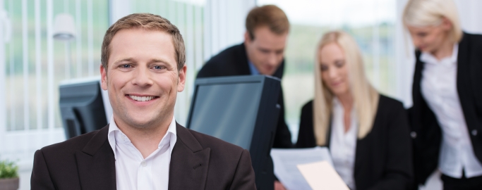 Smiling successful young businessman