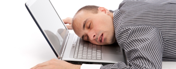 businessman sleeping on laptop